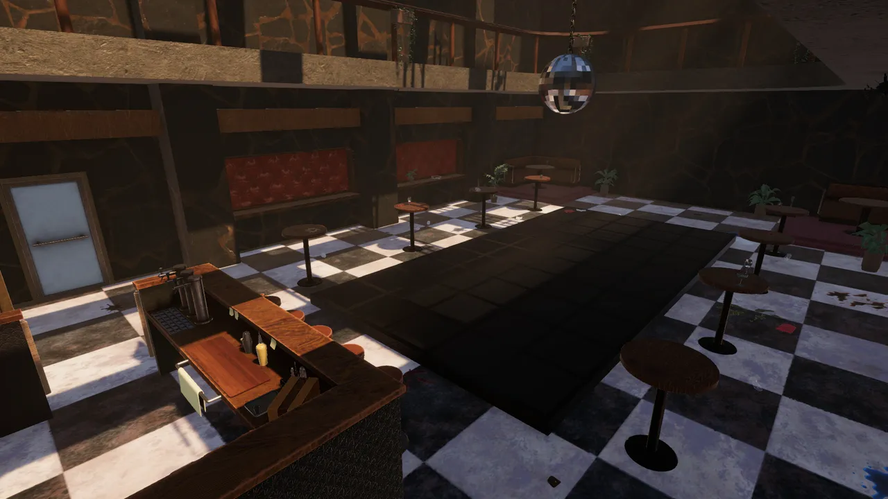 The empty dance floor by day, seen from behind the bar, with the mirror ball overhead.